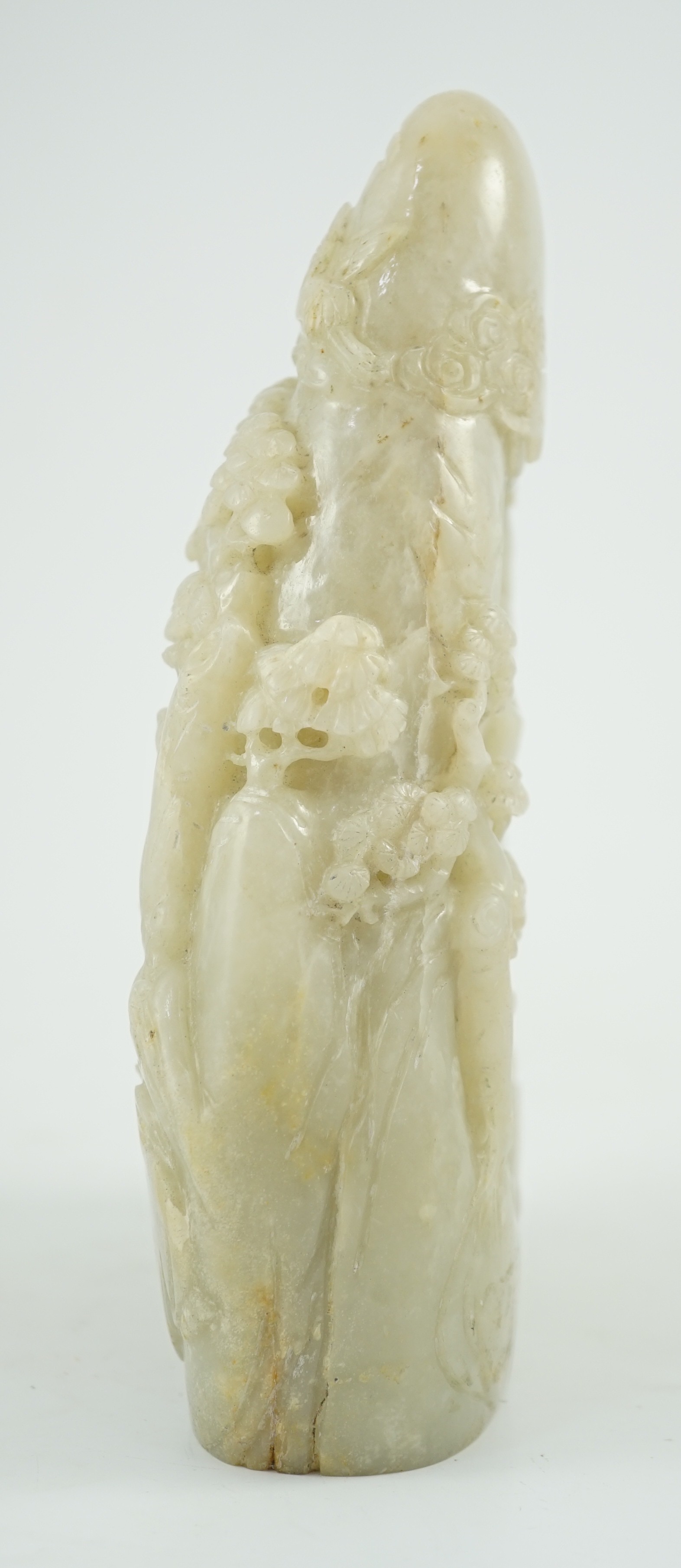 A Chinese pale celadon jade boulder carving, 21cm high 15.5cm wide